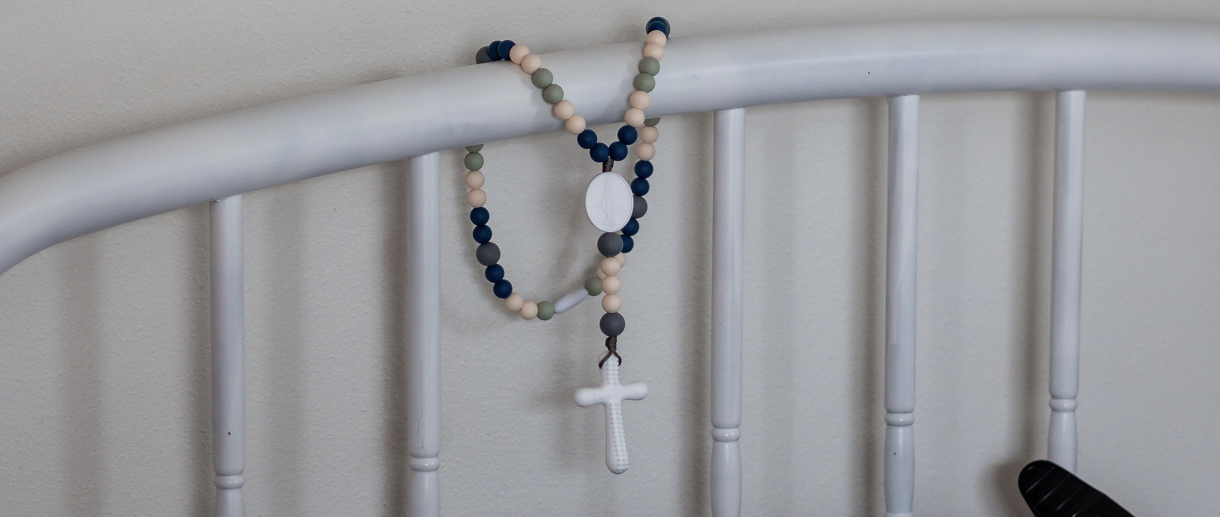 mom uses baby rosary in her labor room to incorporate faith into her birth